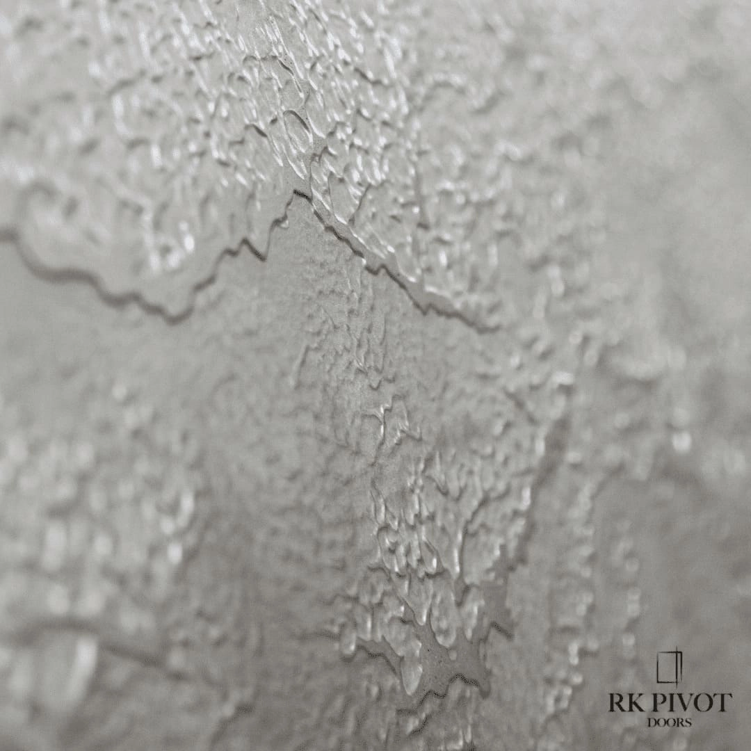 Oversized ROKA pivot entry door with liquid metal cladding installed on a luxury Toronto home