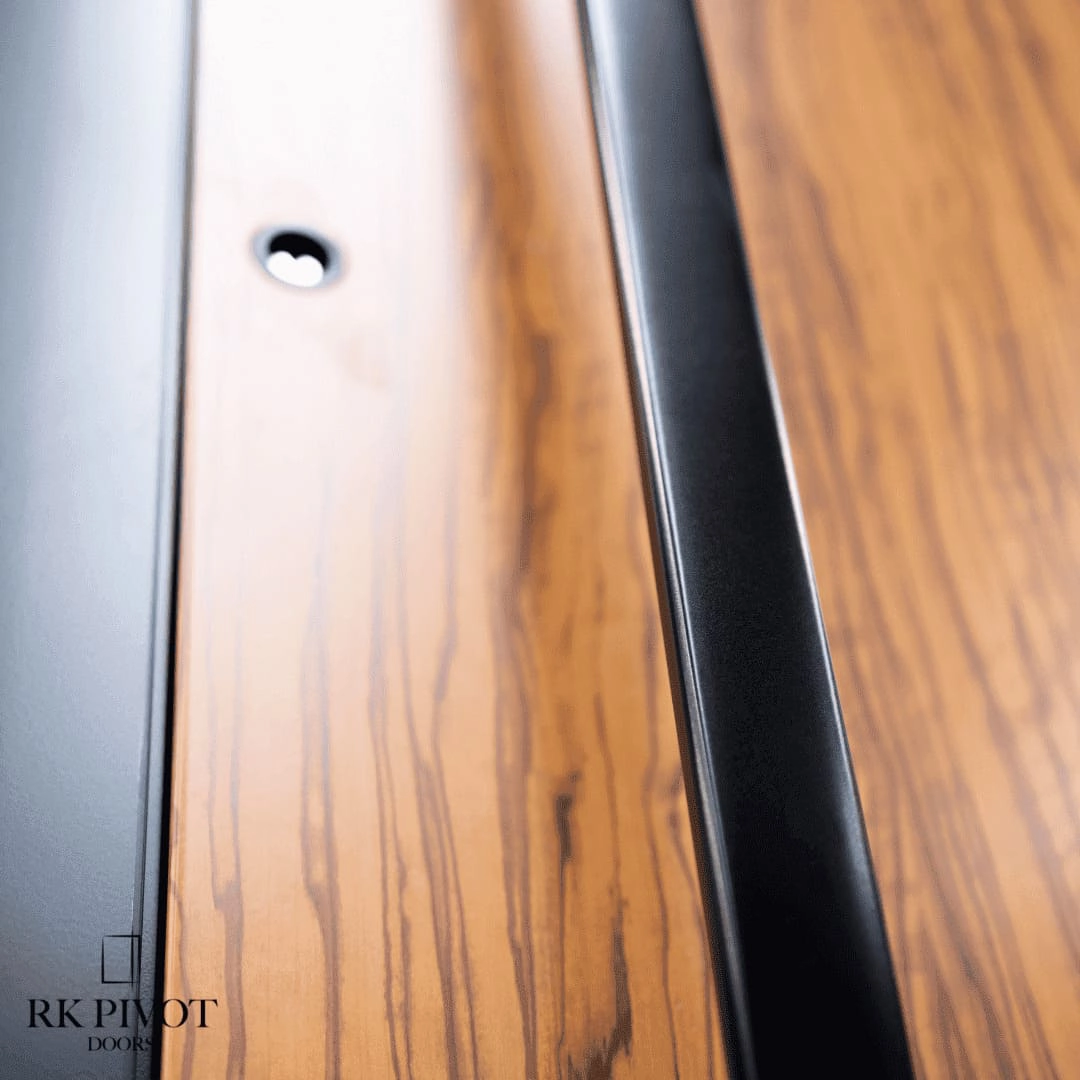 Bi-fold custom patio doors fully open connecting a Toronto living room to an outdoor terrace